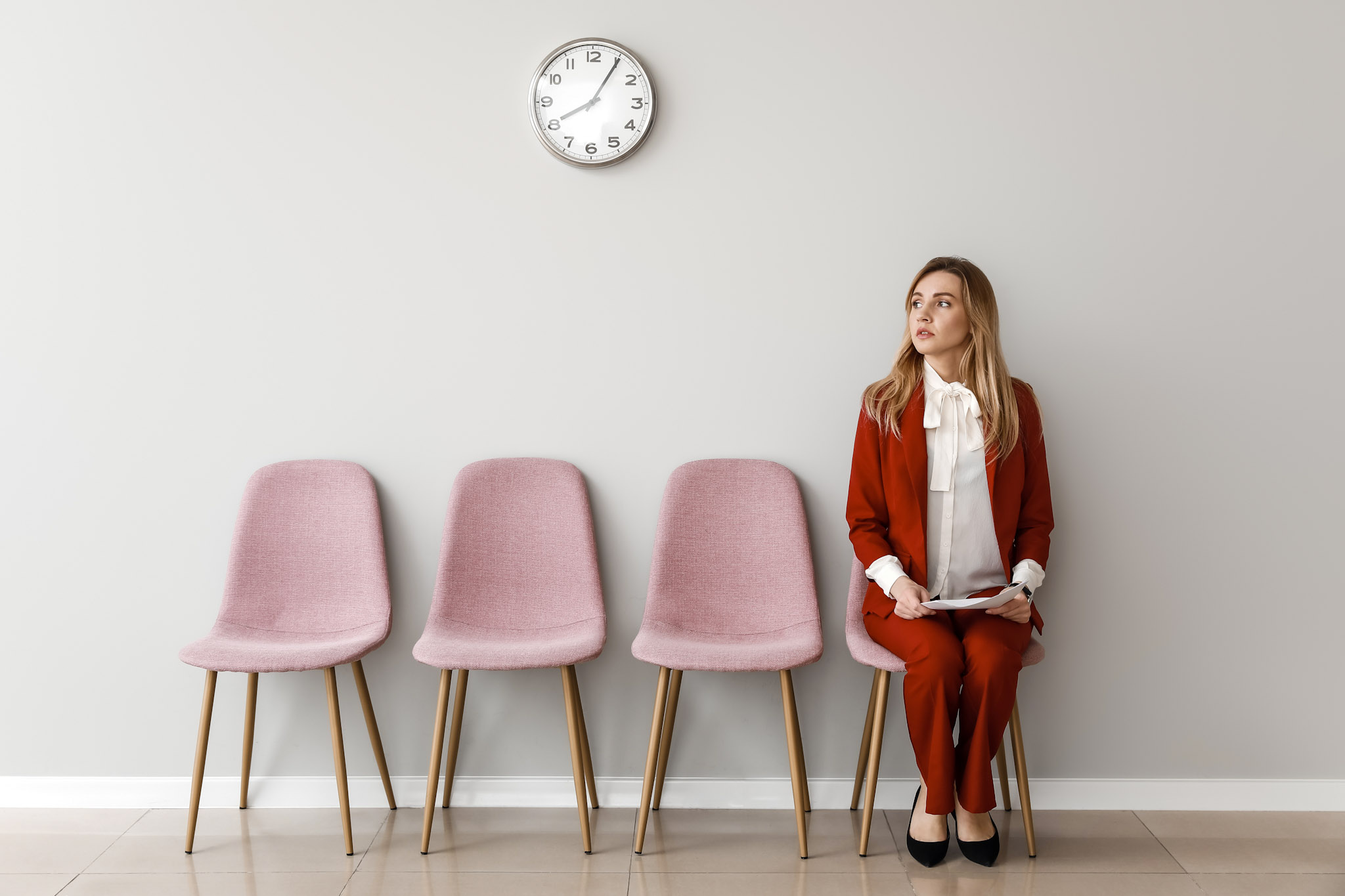 stock image of a young woman waiting for job interview indoors
