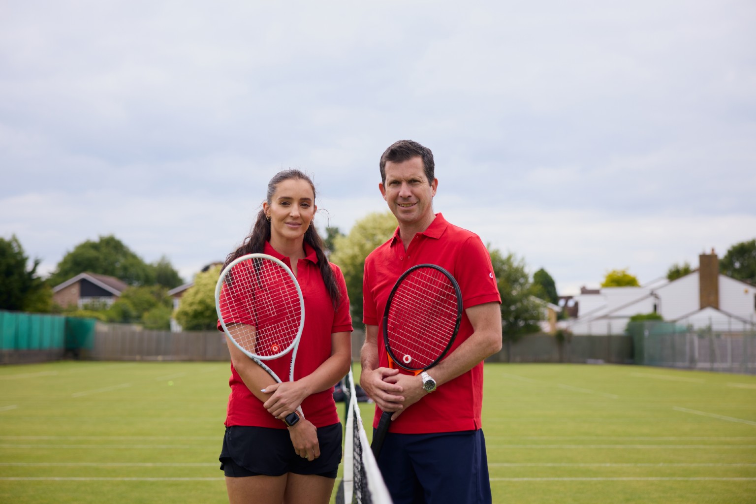 Tim Henman and Laura Robson posing for launch of Vodafone's Better Connect challenge at Wimbledon 2024
