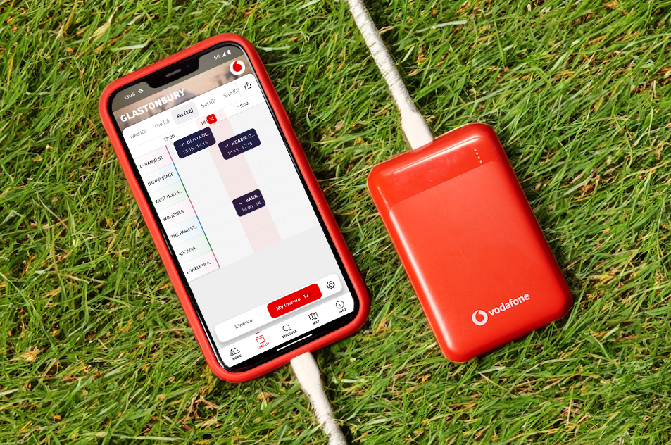The Official Glastonbury Festival App, powered by Vodafone, plugged into a Vodafone-branded portable charger.