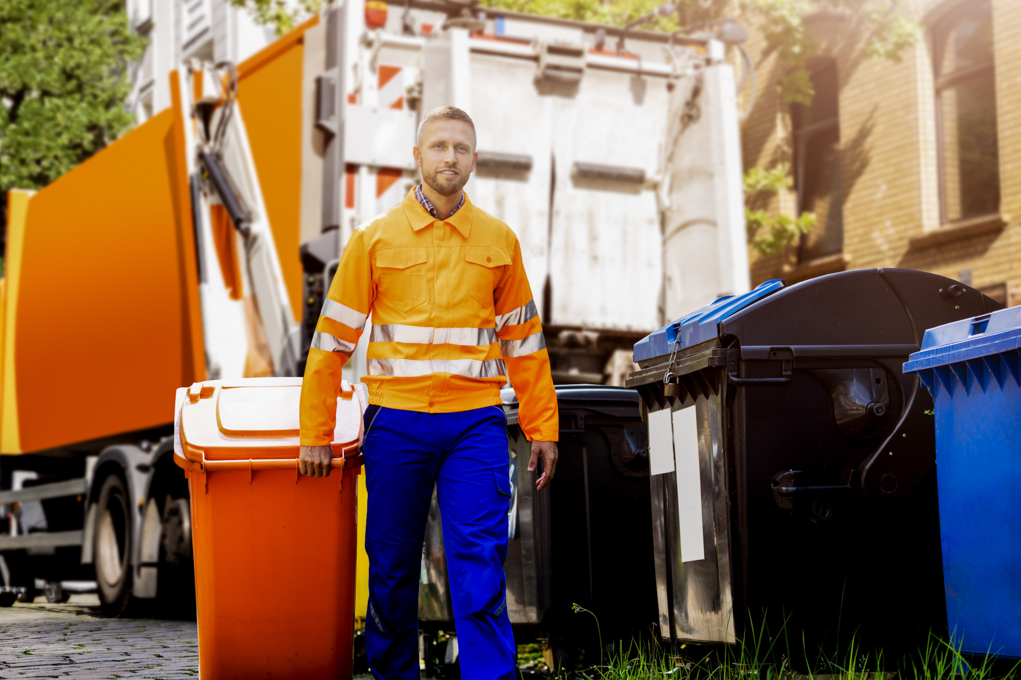 stock image of a refuse collector and a wheelie bin in front of a bin lorry