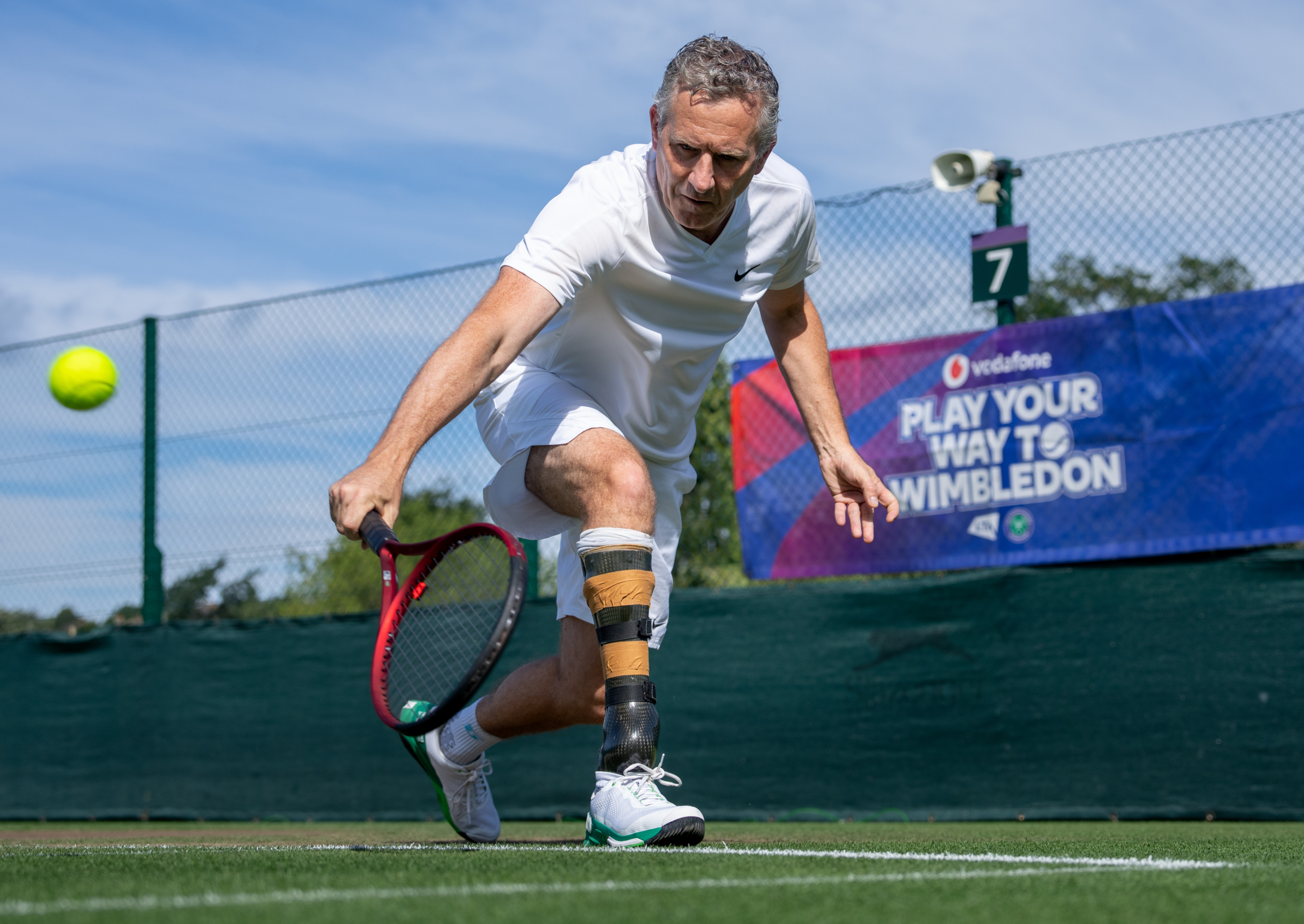 Adam Hills plays at The Play Your Way to Wimbledon event, powered by Vodafone. Held at Aorangi at The All England Lawn Tennis Club, Wimbledon. Day 5 Thursday 15/08/2024. Credit: AELTC/Felix