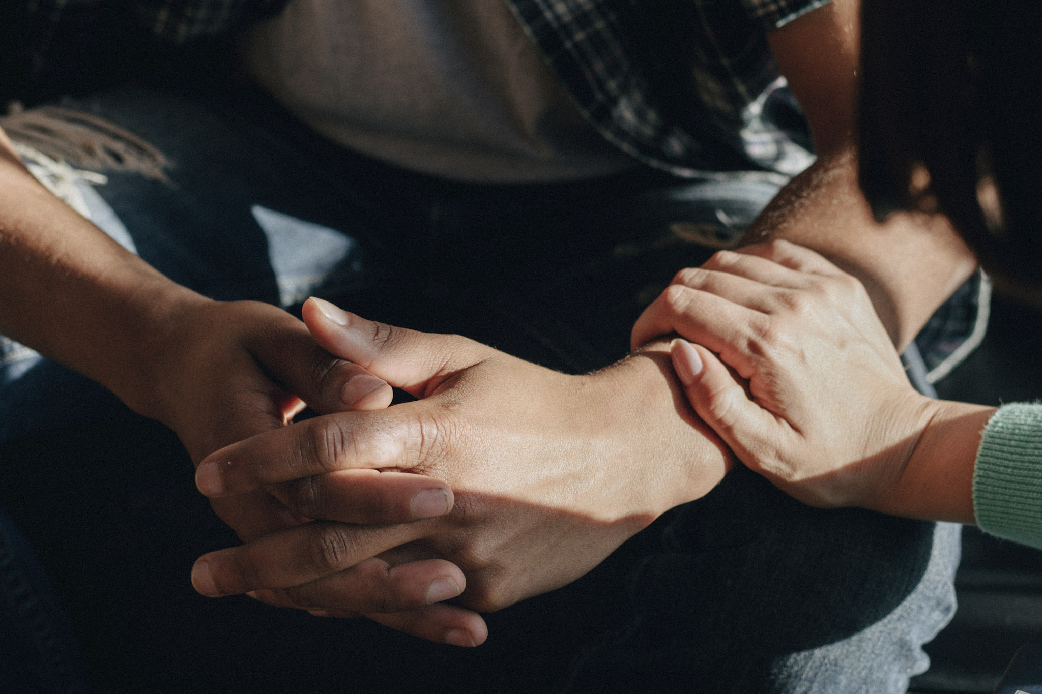 Person holding arm of another