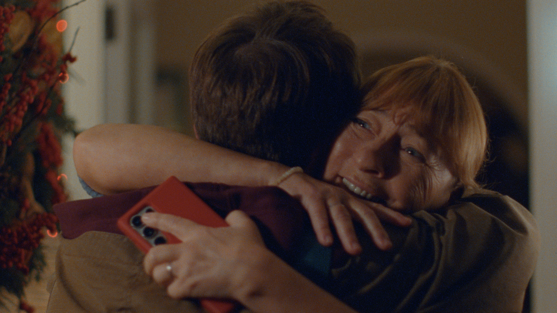 Still of mum hugging sun in 2024 Vodafone Xmas ad.